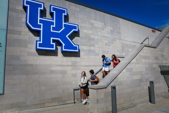 Students at University of KEntucky walk down an outdoor flight of stairs during the day.